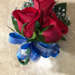 Bouquet of red roses with a blue ribbon bow
