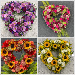 Four heart-shaped floral wreaths in purple, pink, red, and yellow-white tones