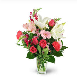 Pink and white mixed bouquet in a clear glass vase