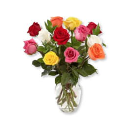 Mixed roses in a clear glass vase