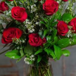 Bouquet of red roses in a clear glass vase