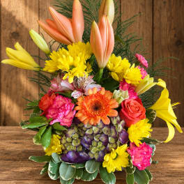 Colorful mixed bouquet with lilies, roses, chrysanthemums, and hydrangeas