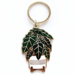 Leaf-shaped keychain with a gold ring on a white background