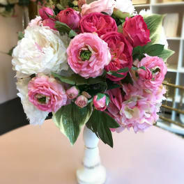 Pink and white flower bouquet in a white vase