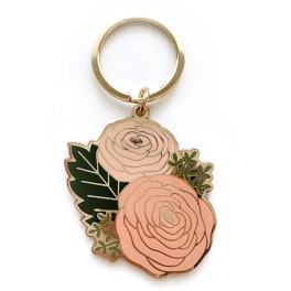 Floral keychain with two pink rose charms and green leaves
