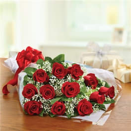 Bouquet of red roses with baby's breath and a red ribbon