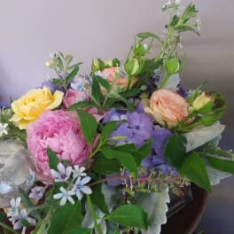 Mixed bouquet with pink, yellow, and lavender flowers