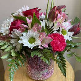 Pink and white mixed bouquet in a mosaic vase