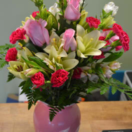 Pink and white mixed bouquet in a pink vase