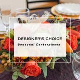 Seasonal centerpiece with mixed flowers and a table setting