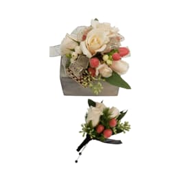 Two small rose arrangements with pink berries and ribbon accents