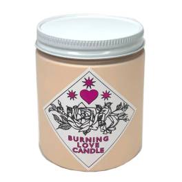 Beige candle in a glass jar with a pink heart label