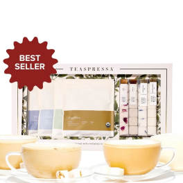 Tea gift set with cups and assorted tea packets in a boxed display
