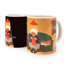Two illustrated ceramic mugs with a cartoon elderly woman and cat design
