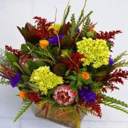 Colorful mixed bouquet in a clear glass vase