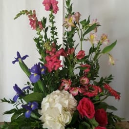 Mixed floral arrangement with pink, white, and purple blooms