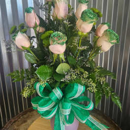 Pink roses in a vase with green ribbon and glittered accents