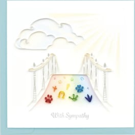 Sympathy card with rainbow paw prints and a bridge under clouds