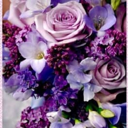 Lavender roses and purple flowers in a bouquet