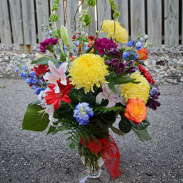 Colorful mixed bouquet in a clear glass vase
