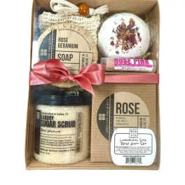 Gift box with rose-scented soap, bath bomb, sugar scrub, and lip balm