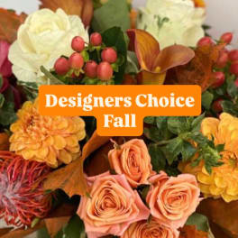Fall bouquet with peach roses, yellow blooms, and orange calla lilies