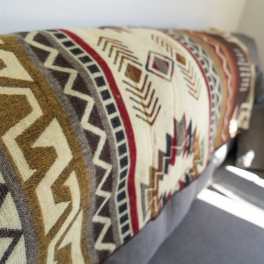 Patterned upholstered bench or sofa with geometric textile