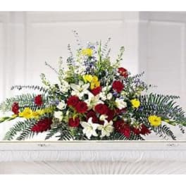 Large red, white, and yellow floral casket spray