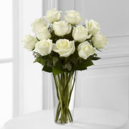 White roses in a clear glass vase
