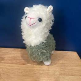 Plush llama toy with a white fluffy head and green body