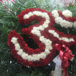 Red and white carnation arrangement shaped like a large number 3