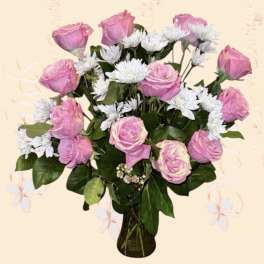 Pink roses and white daisies in a glass vase