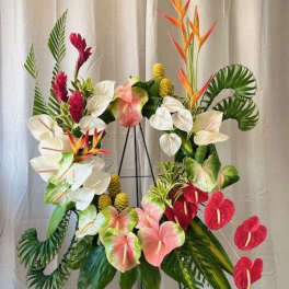 Tropical floral wreath with anthuriums and bird-of-paradise on a stand