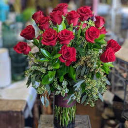 Bouquet of red roses in a glass vase