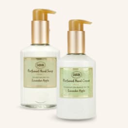 Two pump bottles of lavender apple hand soap and cream