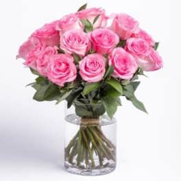 Pink rose bouquet in a clear glass vase