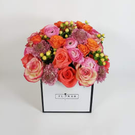 Pink and orange rose bouquet in a white gift box