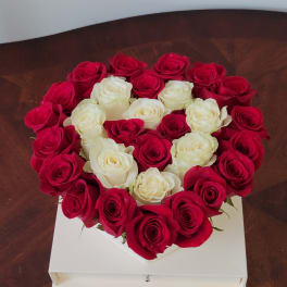 Heart-shaped box of red and white roses
