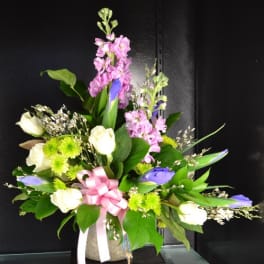 Mixed bouquet with pink, white, and purple flowers in a vase