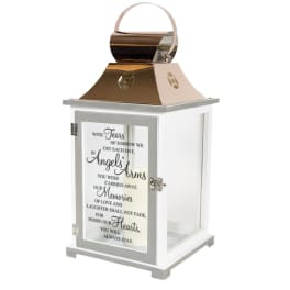 White memorial lantern with metallic top, handle, and remembrance quote on the glass door