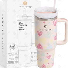 Pink heart-pattern 40 oz tumbler with handle beside branded box