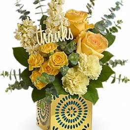 Yellow roses and cream carnations in a decorative box with a "thanks" sign
