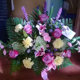 Large bouquet with pink roses, lilies, and pale carnations