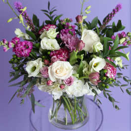 Mixed pink and white bouquet in a clear glass vase
