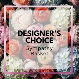 Designer’s choice sympathy basket text over pastel flowers