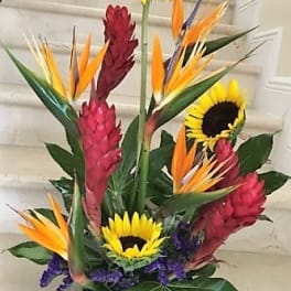 Tropical arrangement with sunflowers and bird-of-paradise flowers