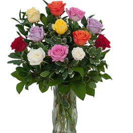 Mixed-color roses in a clear glass vase