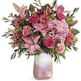 Pink mixed bouquet in a iridescent glass vase