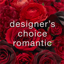 Close-up of red roses with overlaid text reading designer's choice romantic