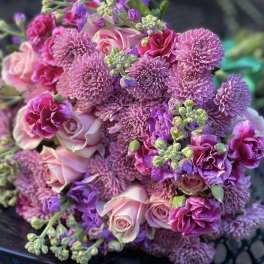 Bouquet of pink and purple roses, chrysanthemums, and carnations